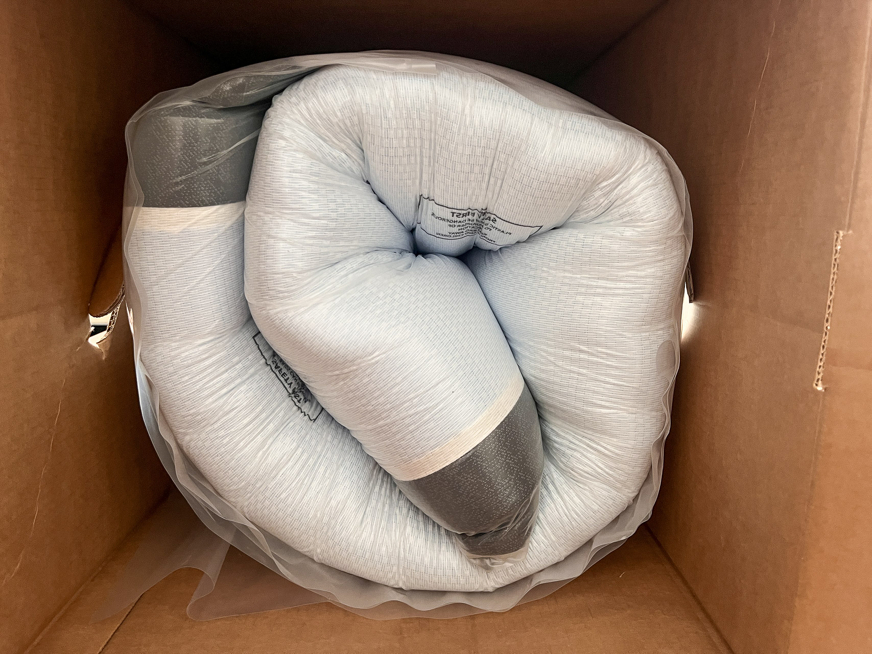 Emma luxe cooling mattress rolled up in box